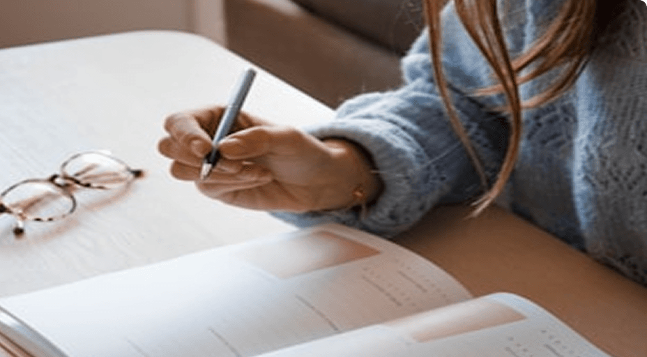 Board Exam Countdown Planner Student writing notes for board exam countdown planning