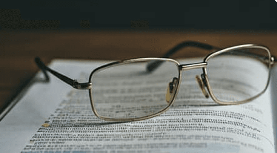 CGPA to Percentage Calculator Eyeglasses resting on study notes for CGPA calculation